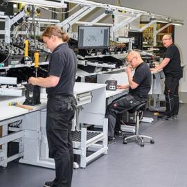 men doing tasks at ergonomic workstations